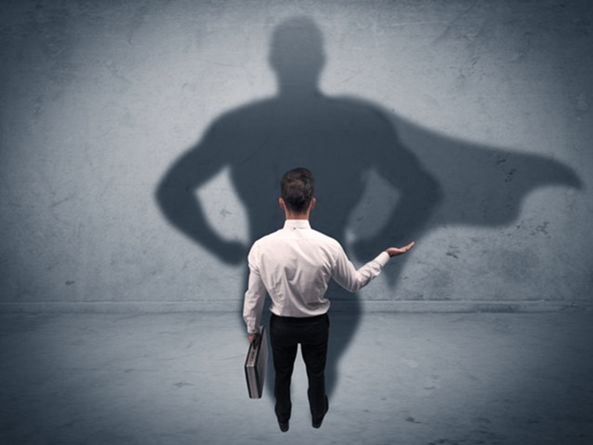 an image of a business man with a superhero shadow