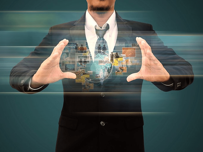 an image of a man in a business suit holding an in house recruiting graphic