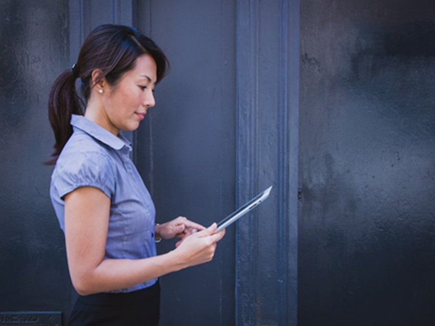 an image of a business woman on an ipad