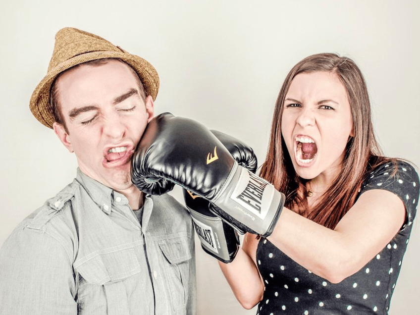 an image of a man and woman boxing