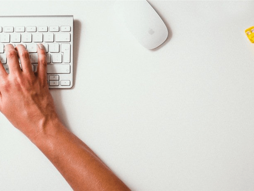 an image of a woman typing on a keyboard