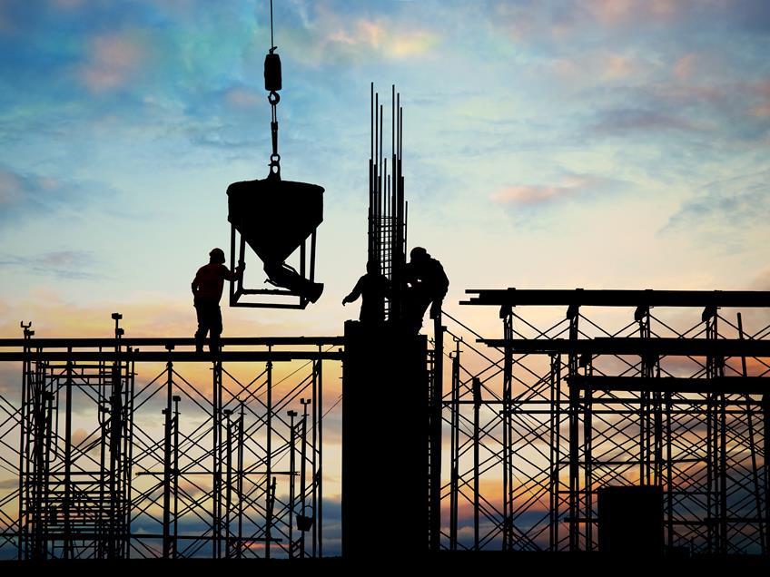 Men working on a building site as Construction Vacancies plummet