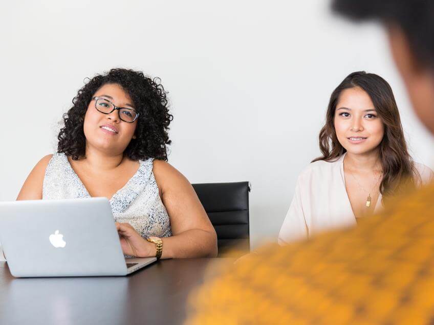 women explaining job distribution software